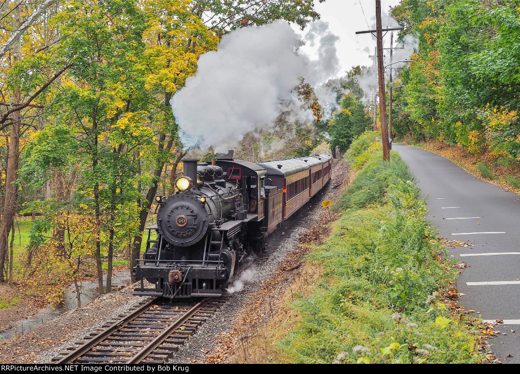 Just after departing the depot, NHIR 40 leads the westbound train up the hollow of Aquetong Creek